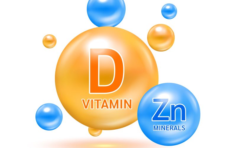 Minerals zinc Zn and Vitamin D capsule solution serum colorful balls. On white background. Healthy food supplement. 3D Realistic Vector EPS10.