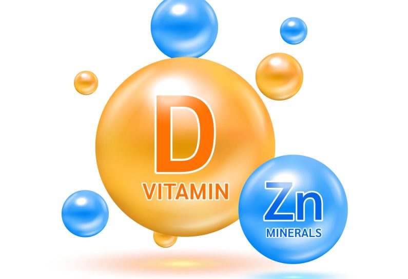 Minerals zinc Zn and Vitamin D capsule solution serum colorful balls. On white background. Healthy food supplement. 3D Realistic Vector EPS10.