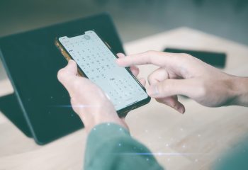 Concept of time management financial planning and reminder for 2024. man using smartphone working with calendar 2024, business planning marketing and investment, schedule appointment meeting