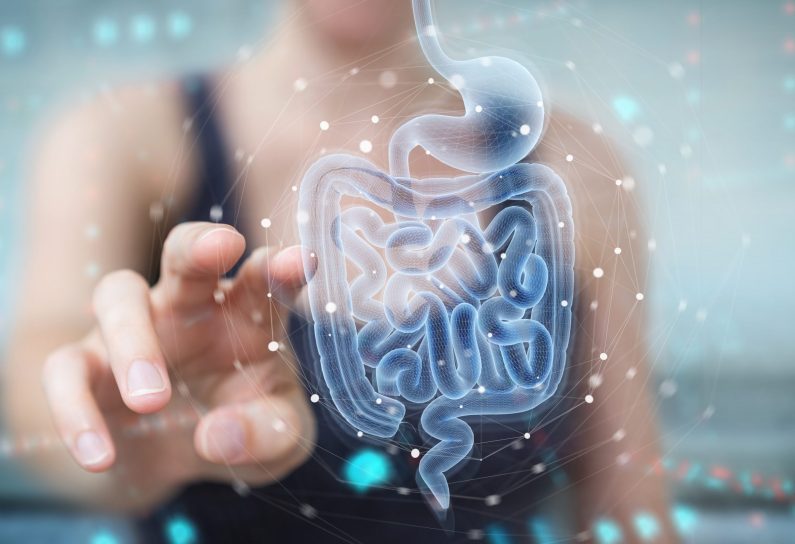 Woman on blurred background using digital x-ray of human intestine holographic scan projection 3D rendering